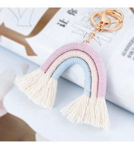Detail of bohemian rainbow tassel keychain with macaron cotton rope and rose gold clasp