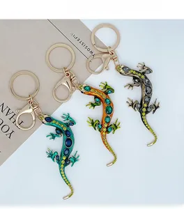 Detailed view of creative lizard keychains with colorful rhinestones and gold lobster clasps