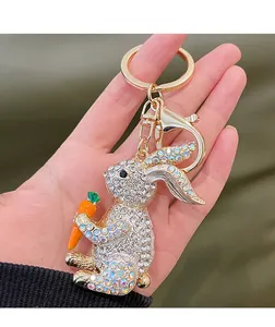 Detailed close-up of a rabbit keychain with sparkling rhinestones and a carrot accessory