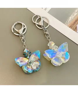 Detail view of crystal butterfly keychain with iridescent AB coating and silver metal clasp