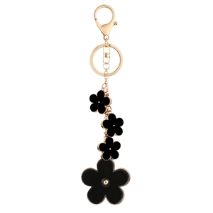 Elegant gold keychain featuring multiple black enamel camellia flowers with lobster clasp