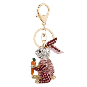 Sparkling pink rhinestone rabbit keychain with carrot charm and golden metal hardware