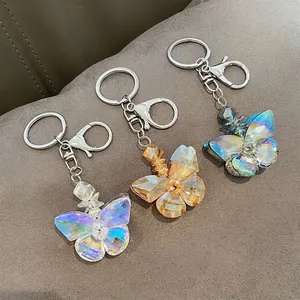 Elegant crystal butterfly car keychain set in purple gold and blue green colors