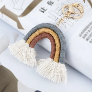 Handmade bohemian rainbow keychain in grey and ginger yellow with cotton fringe tassel
