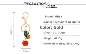Detail of metal keychain with persimmon and orange pendants, 11.5cm length design