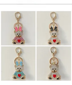 Détails de porte-clés ours étincelants avec nœuds papillon en quatre coloris