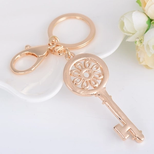 Porte-clés créatif en alliage de zinc doré avec strass et motif floral évidé