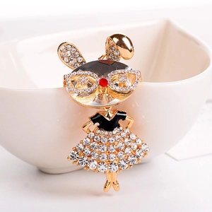 Sparkling crystal rabbit girl keychain charm in gold metal with black enamel and red accents