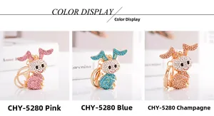 Tre colori di portachiavi a forma di coniglio in rosa, blu e oro champagne con strass