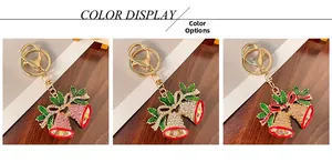Three colors of Christmas bell keychains with rhinestones and enamel leaf details