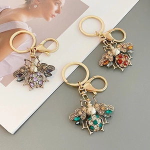 Sparkling rhinestone bee keychains in purple, red, and green with lobster clasps