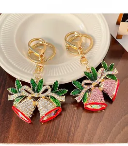 Close-up of sparkling rhinestone Christmas bell keychains in red and white colors