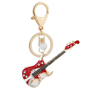 Porte-clés guitare électrique rouge avec cristaux brillants et une perle blanche