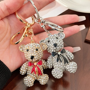 Elegant rhinestone bear keychain set in gold and silver with colorful bow details