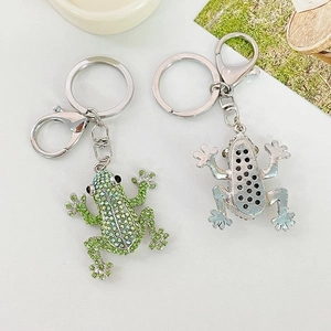 Sparkling frog keychain with green and blue crystals on a silver metal base