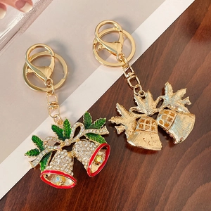Christmas bell keychain with rhinestones and enamel bow on a gold-plated metal ring
