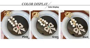 Bowtie pearl keychains in pink, green, and black with sparkling rhinestone details