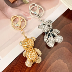 Chic rhinestone bear keychains in gold and silver finish with elegant bow detail