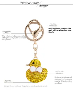 Detailed view of handmade duck keychain with sparkling yellow rhinestones and gold alloy lobster clasp