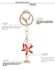 Detail of red helicopter keychain with hand-set rhinestones and polished gold-plated finish