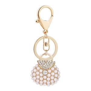 Miniature handbag keychain with pearls and crystals on a gold-plated metal ring