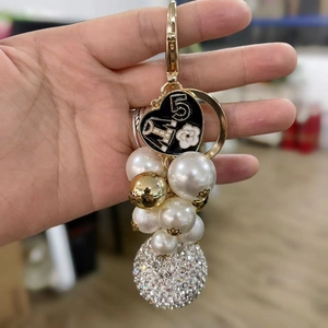 Elegant key chain with number 5 heart pendant, pearls, and sparkling rhinestone ball charm