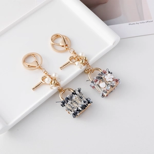 Elegant camellia tweed mini bag keychain with pearls and golden alloy hardware