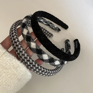 Three stylish black and white plaid headbands and textured hair hoops for women