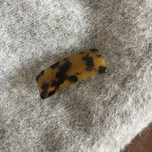 Detail of tortoise shell acetate hair clip with France Handmade gold lettering