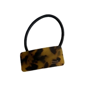 Elegant French style tortoise shell acetate rectangle pendant on a black elastic hair tie