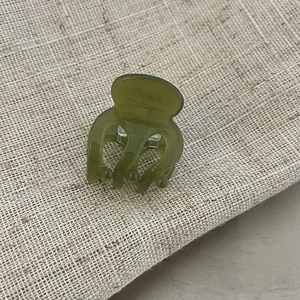 Mini olive green acetate hair claw clip with France Handmade lettering on linen