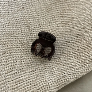 Mini acetate tortoise hair claw clip with France Handmade gold lettering on beige fabric