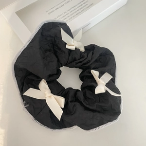 Elegant large black scrunchie with three cream bows and refined white edge detailing