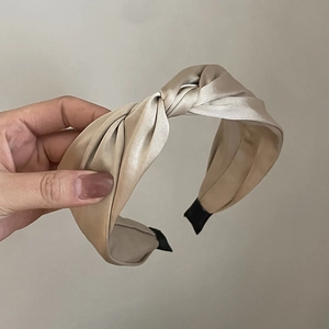 Elegant champagne silk satin knotted headband with vintage twist design for women