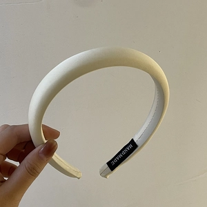 Elegant off-white satin padded sponge headband with handmade woven label for women