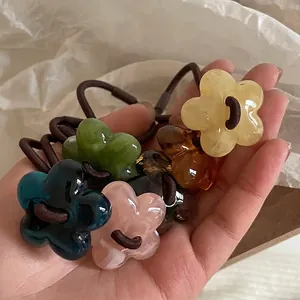 Set of five-petal flower hair ties in assorted jelly colors with high-elastic bands