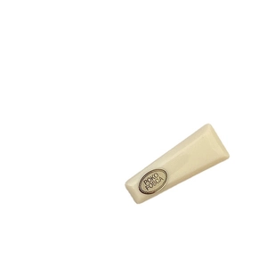 Creamy macaron acrylic hair clip with a gold POKO FOSCA emblem on a white background