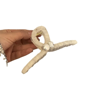 Large cream fabric shark hair claw clip with elegant crystal and pearl embellishments