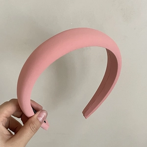 Chic pink sponge headband for high top knot look with matte fabric texture finish