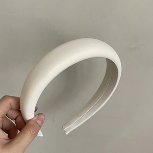 Minimalist thick cream sponge headband with matte fabric for high cranial top effect