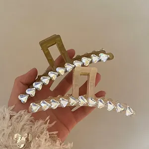 Elegant large resin hair claw clips with heart-shaped rhinestones in green and cream white