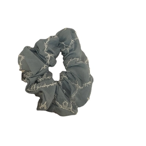 Elegant grey-blue scrunchie with white fringe mesh texture for girls' hair styling