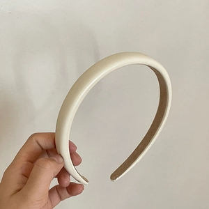 Detail of cream matte leather headband with brown non-slip inner lining for women