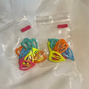 Lot de barrettes à cheveux colorées en forme de cœur dans des sacs transparents pour filles