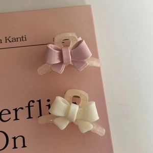 Barrettes à nœuds rose et ivoire avec finition mate pour une coiffure élégante