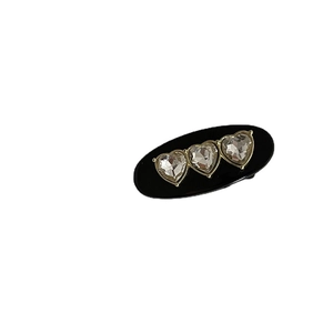 Elegant black heart rhinestone hair clip with three crystals in gold settings