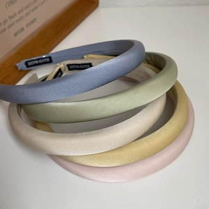Five-piece set of thick satin headbands in pastel colors for a high-crown look