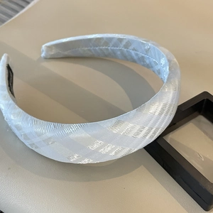 Detailed macro view of a thick padded headband with a white checkered woven texture
