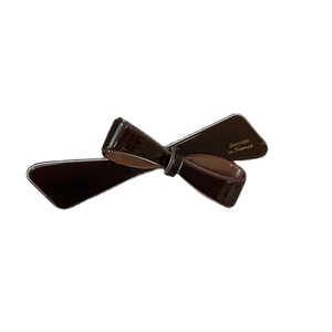 Fermaglio per capelli a fiocco in acetato marrone scuro con scritta dorata Barrette la France