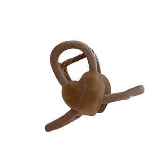 Elegant heart-shaped hair claw clip in coffee marble finish for women's hairstyles